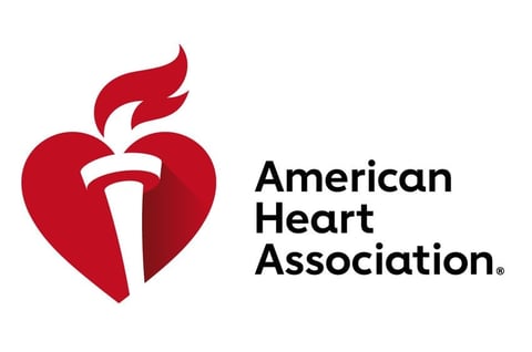 American Heart Association logo featuring a red heart with a torch symbol and organization name in black text
